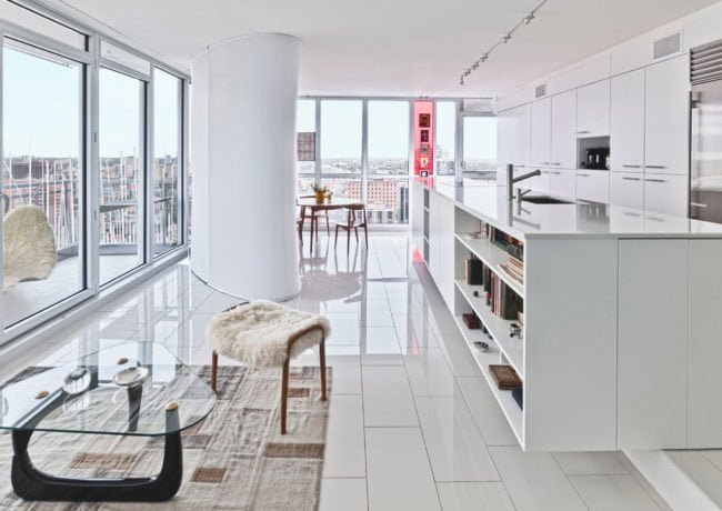 Redeveloper Apartment living area and kitchen with view of balcony