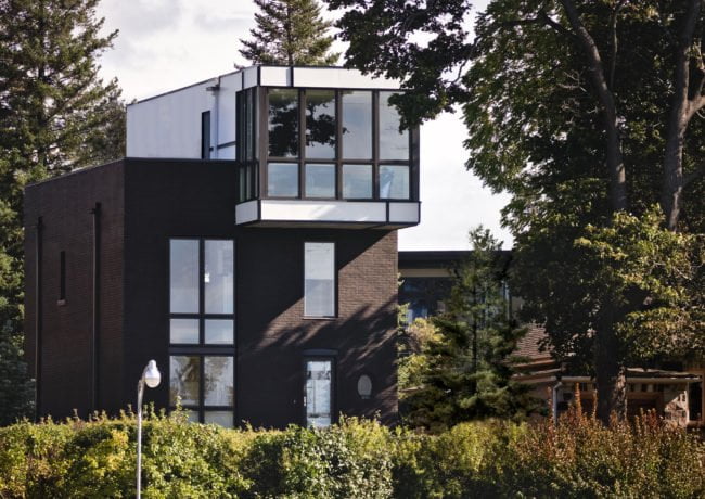 Exterior view of Echo House from distance surrounded by trees