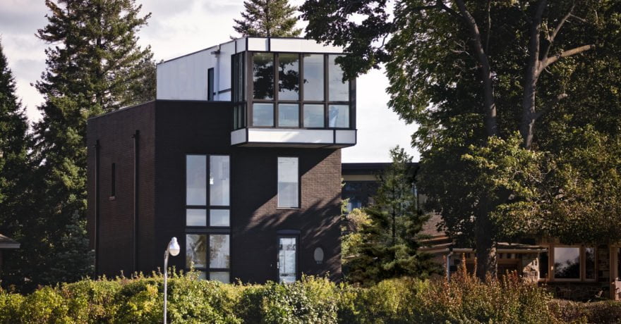 Exterior view of Echo House from distance surrounded by trees