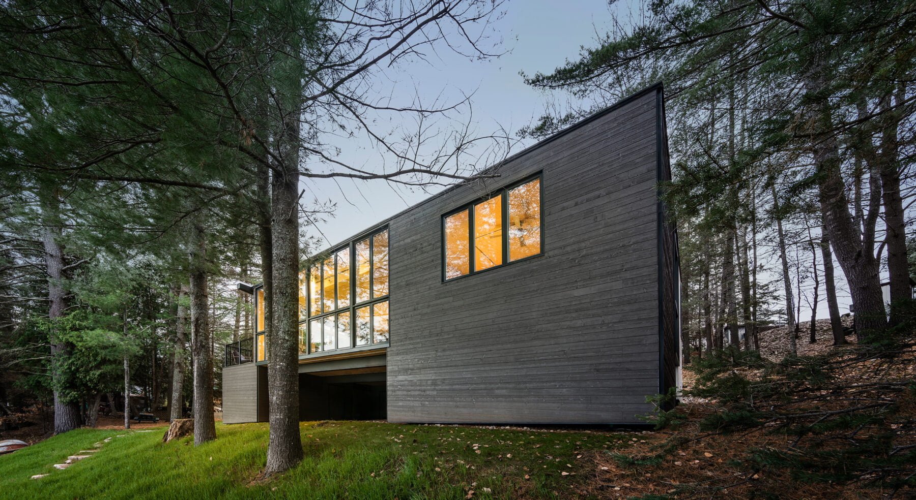 Angled shot of CLT Cottage exterior from lake